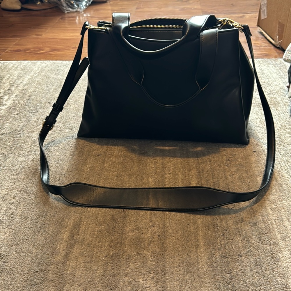 A New Day purse with carrying strap